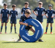 Young Rugby Player Using Tackle Ring - Junior
